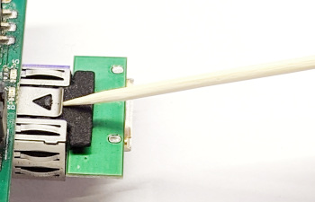 Using a toothpick for removal of XillyUSB sfp2usb adapter from SFP+ cage